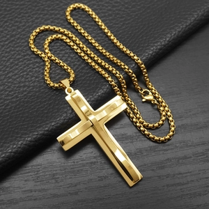 Minimalist wavy cross pendant necklace in gold finish on black textured leather