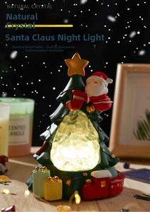 Macro detail of Christmas tree night light with natural white crystal and mini red train