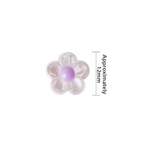 Macro detail of a 12mm acrylic daisy bead with frosted petals for DIY jewelry making