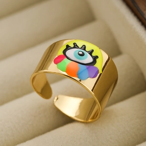 18K gold plated wide open ring with colorful enamel evil eye motif on jewelry display