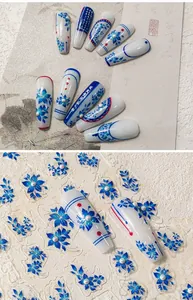 Detailed blue and white floral nail stickers with 3D pearls and embossed art patterns