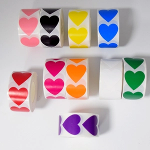 Detailed view of nine rolls of heart-shaped adhesive stickers in multiple vibrant colors