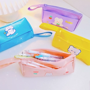 Cute large capacity double-layer canvas pencil cases in blue, pink, purple, and yellow