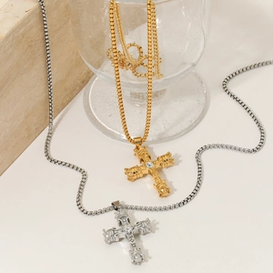 Baroque cross pendant necklace in gold and silver finish with embossed relief details