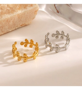 Detailed view of adjustable leaf open rings in polished gold and silver finishes