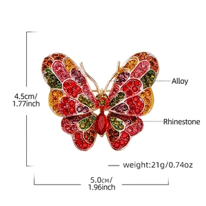 Golden butterfly brooch with colorful rhinestones measuring 5.0cm x 4.5cm and weighing 21g