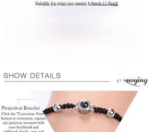 Macro detail of custom photo projection bead on adjustable black braided rope bracelet