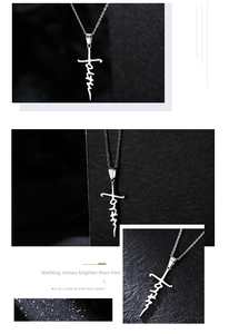 Macro detail of silver Faith letter cross pendant in polished stainless steel finish