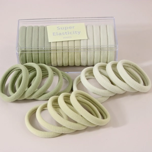 Detail of 15-piece high elasticity hair tie set in Morandi green with clear storage box
