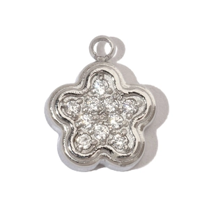 Detailed view of silver flower clover pendant with inlaid cubic zirconia and top ring