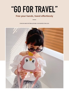 Detail of pink penguin kids bag made of Napa leather with six-pointed star lock