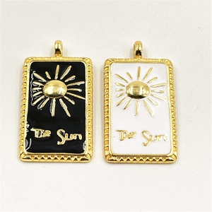 Gold plated tarot sun pendants set with black and white enamel in rectangle shape