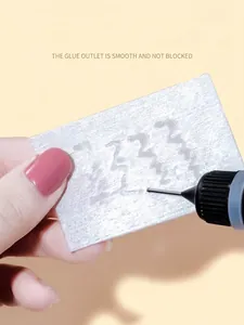 Macro detail of smooth dispensing with precision metal needle on white fiber surface