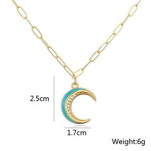 Detail showing gold moon pendant dimensions 2.5x1.7cm and weight 6g on white background