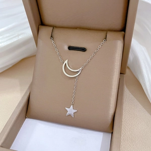 Minimalist titanium steel crescent moon and star necklace in a luxury jewelry gift box