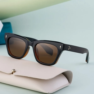 Polarized sports sunglasses with black frames and brown lenses including a leather case