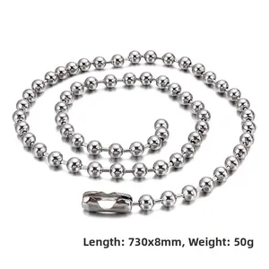 Detailed spiral arrangement of a silver stainless steel ball chain with connector clasp