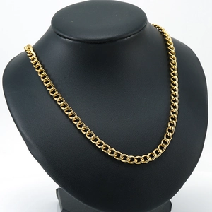 Detailed view of an 18K gold plated stainless steel Cuban chain on a black bust display