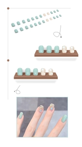 Detail of short pale green press-on nails with sparkling heart glitters and 3D accents