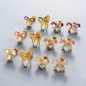 Collection of 12 gold butterfly cartilage earrings with colorful cubic zirconia studs
