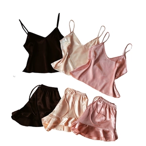 Three sets of silk satin pajamas with camisole and ruffle shorts in brown, gold, and pink