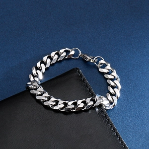 Polished silver stainless steel Cuban link chain bracelet for men on black leather base