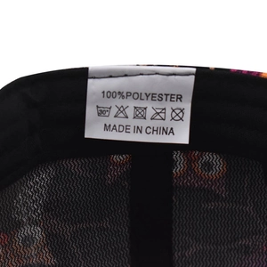 Detail view of cotton baseball cap inner care label showing 100% polyester fabric material