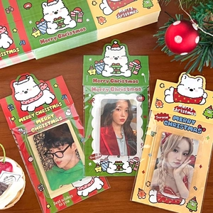 Detail of Christmas cartoon puppy card holder with festive red and green holiday patterns