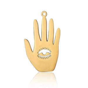 Detail of golden stainless steel palm pendant with hollow eye design and metal ring