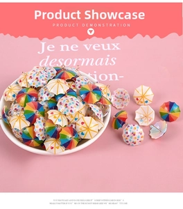 Close-up of colorful resin mini umbrella charms with heart and polka dot patterns