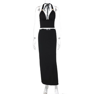 Detailed front view of black halter neck crop top and high waist slim fit maxi skirt set