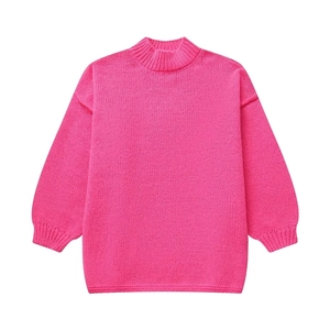 Close-up of bright pink oversized knit sweater featuring ribbed cuffs and neckline texture