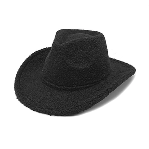 Close-up of black teddy fleece cowboy hat showing textured wool and wide brim details