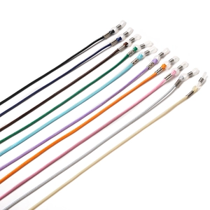 Ten colorful woven eyeglass cords in diagonal flat lay on a clean white background