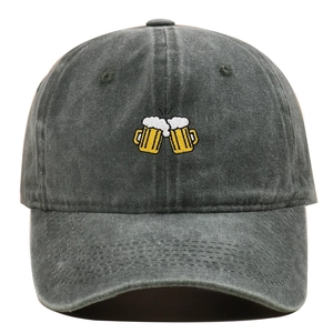 Detail of beer mugs embroidery on charcoal grey washed cotton baseball cap texture