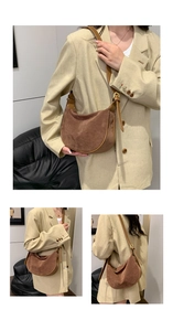 Detailed texture of dark brown suede hobo bag with contrast leather strap and hardware