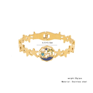Detail of gold stainless steel star bracelet with tropical coconut tree enamel charm