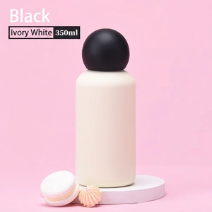 Elegant 350ml ivory white vacuum flask with black spherical lid on a display stand