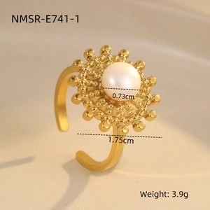 Detail shot of golden sunflower ring with pearl center showing 1.75cm size and 3.9g weight