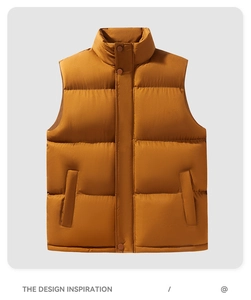 Detailed close-up of dark ochre puffer vest with stand collar and snap-button closure