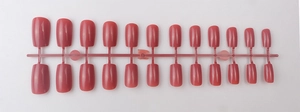 Glossy long square press-on nails in dusty rose pink finish displayed on a plastic rack