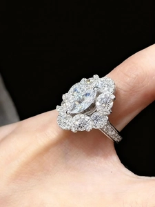 Detailed macro view of a marquise cut zircon ring with clustered side diamonds