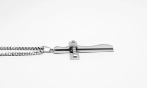 Macro side view showing the thick layered texture of the punk cross pendant necklace