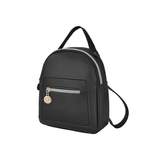 Modern black faux leather small backpack with gold accents on a white background