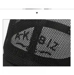 Detail shot of breathable black mesh back and AKUBLE embroidery on the baseball cap
