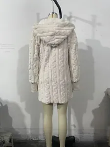 Detail of cream cable-knit hooded cardigan featuring thick texture and ribbed cuffs