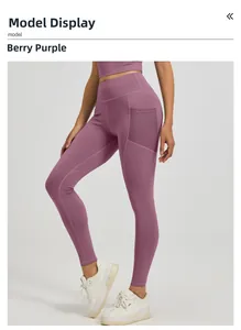 Detail of high waist berry purple yoga leggings with functional side pockets