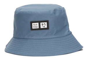 Detailed close-up of blue cotton bucket hat with smiley face patch and stitched brim