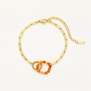Detail of linked gold stainless steel rings with orange stone beads and S-STEEL tag