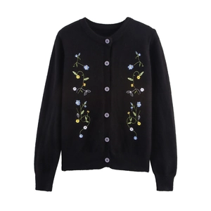Women's black crewneck knit cardigan with delicate floral embroidery and purple buttons